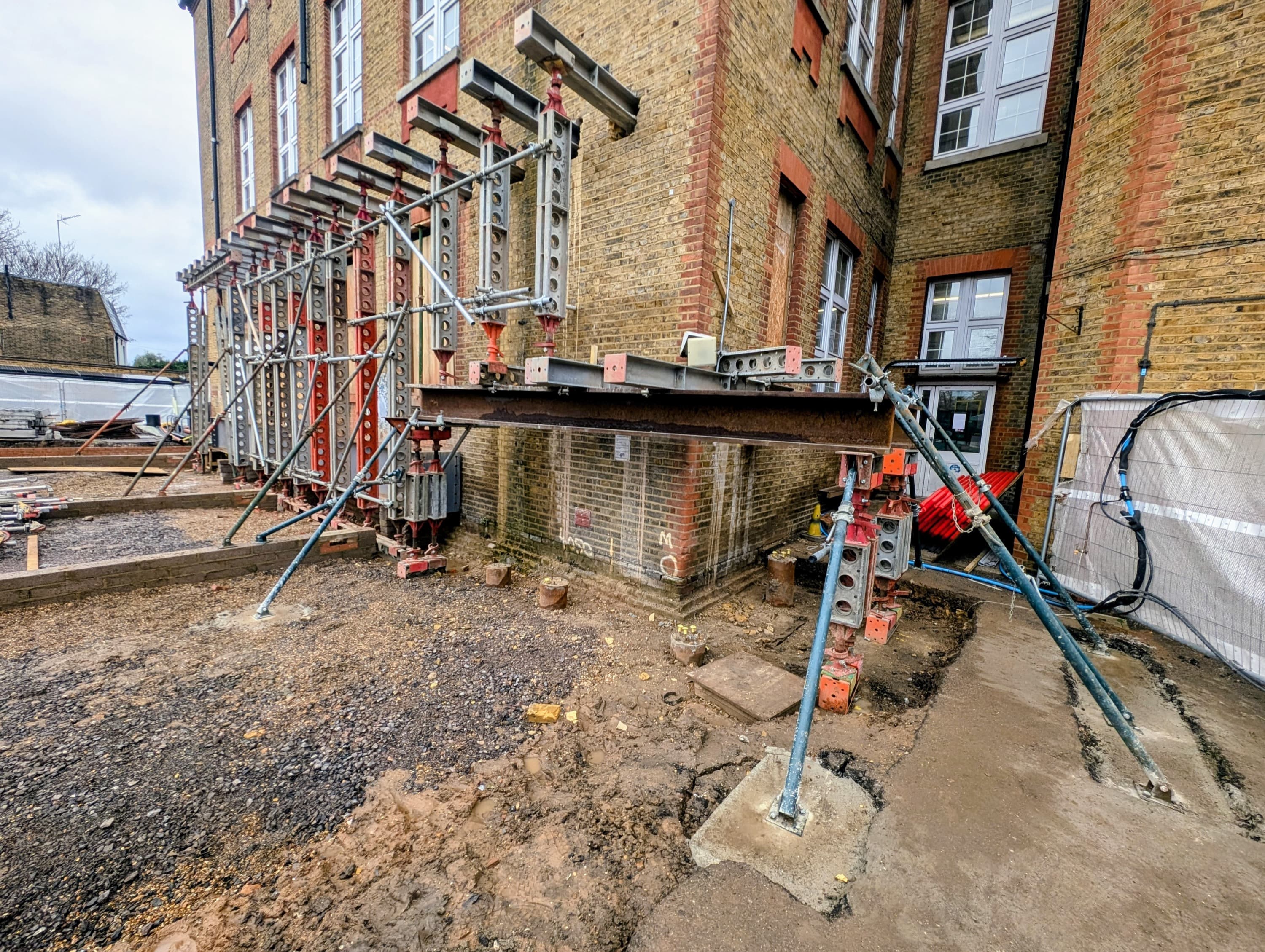 Bespoke structural steelwork supporting the undermined corner over the pile-cap