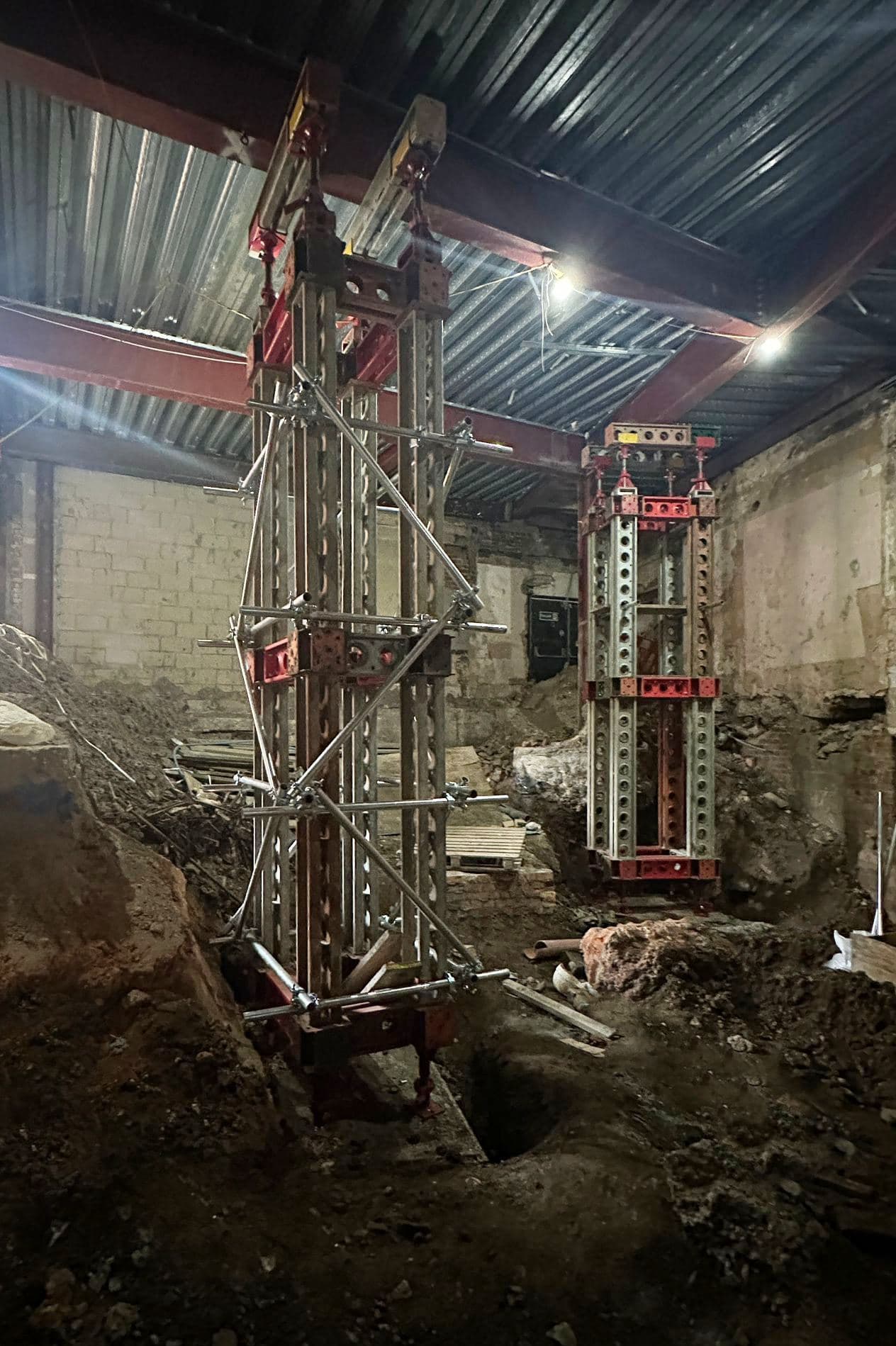 Slimshore propping towers installed indoors supporting retained slabs and beams
