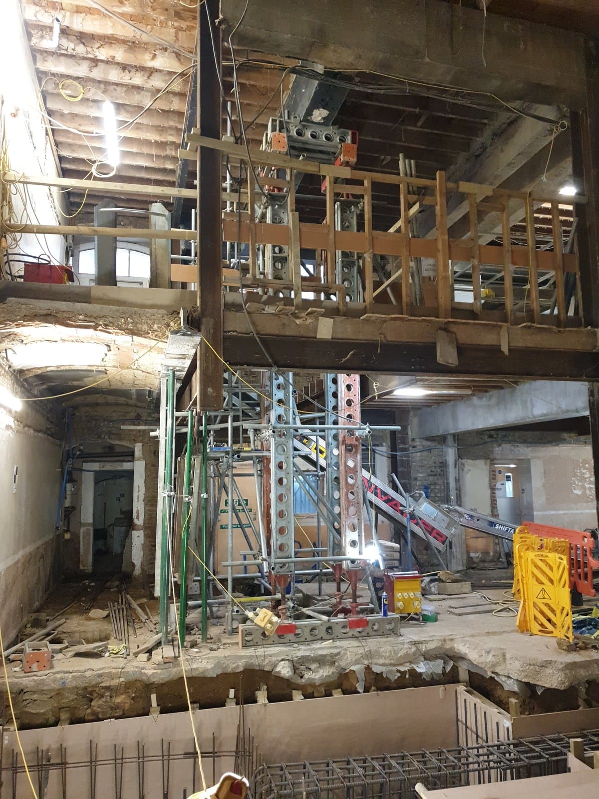 Slimshore propping tower rising from basement level in the hotel foyer