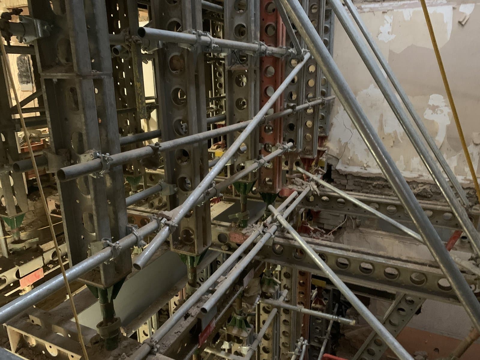 Slimshore soldiers braced with raking scaffold tube within the hotel