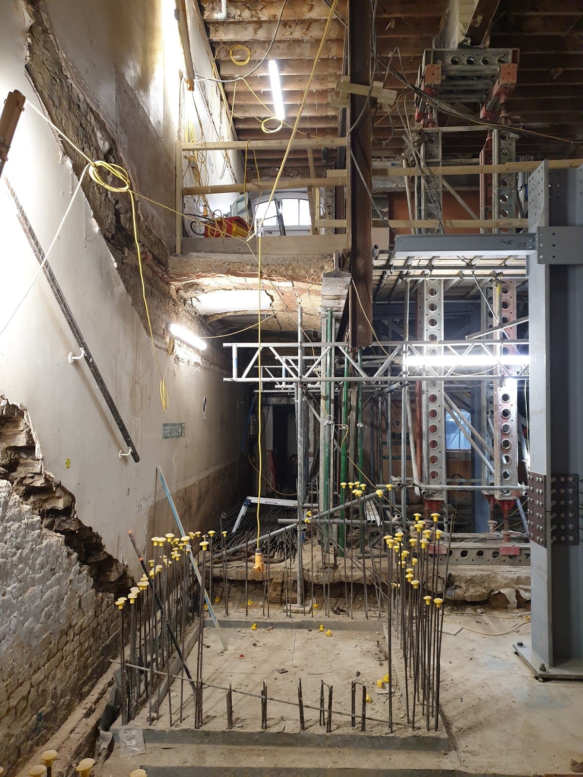 Slimshore tower next to reinforcement for a new permanent pad foundation