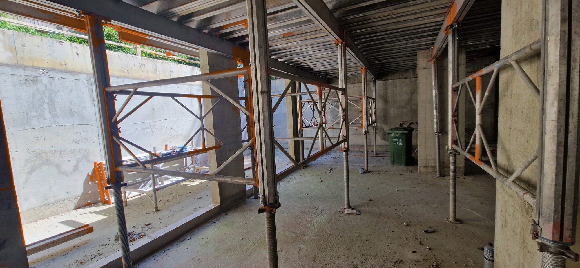 Grid view of Titan Deck support legs and H20 primary and secondary beams beneath concrete slab