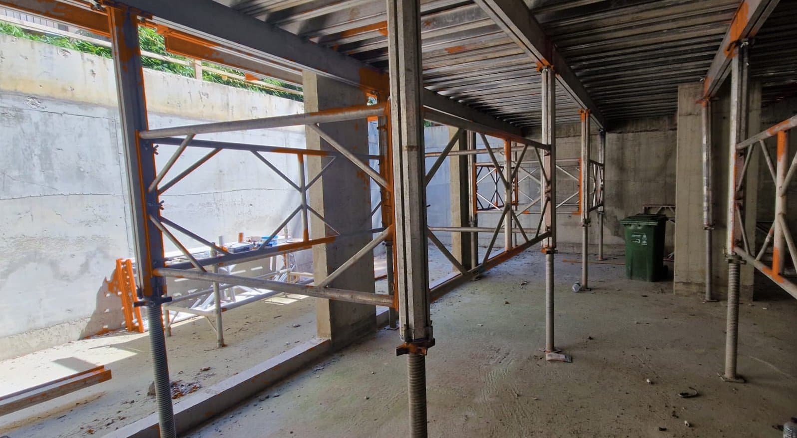 Grid view of Titan Deck support legs and H20 primary and secondary beams beneath concrete slab