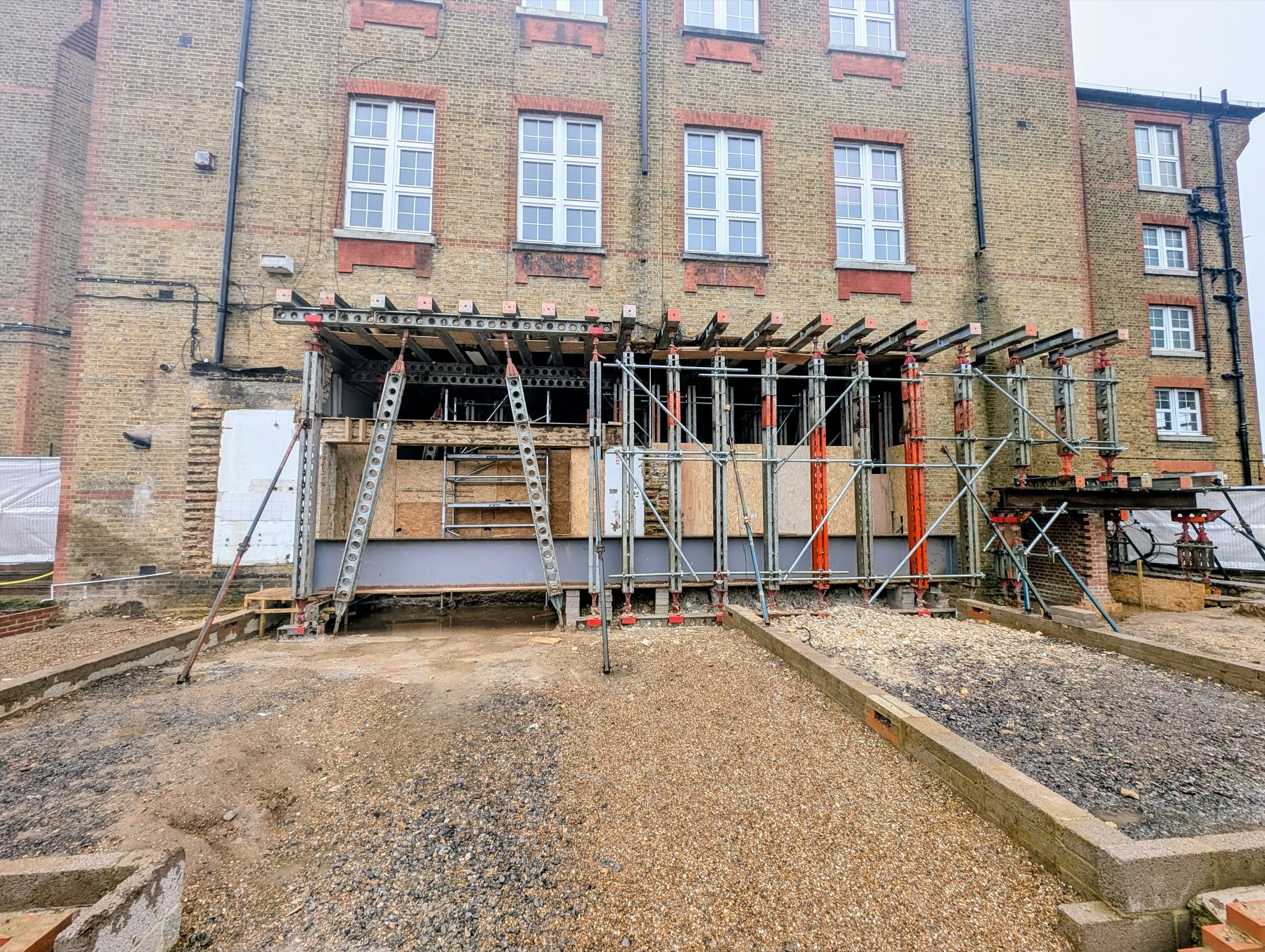 Completed 15m Slimshore propping and needling run installed across the structural opening at the Chiswick school