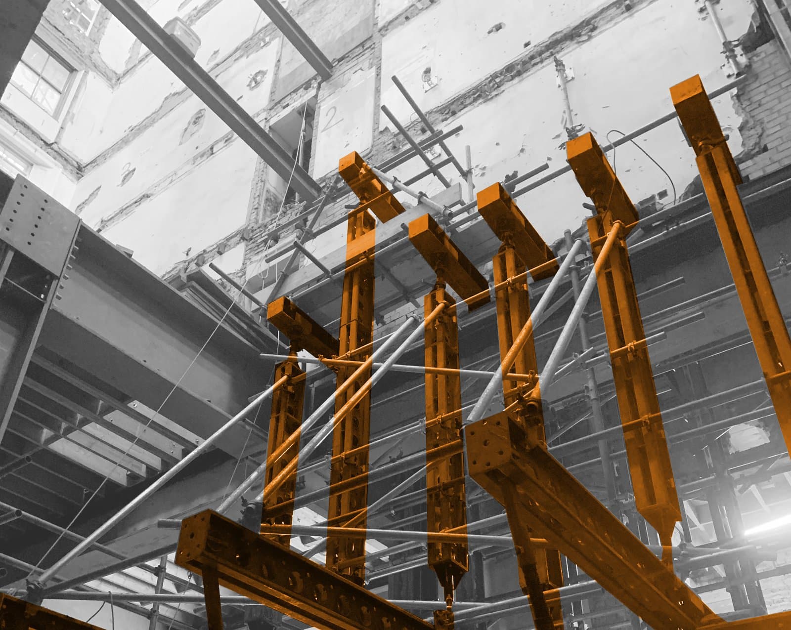 Slimshore soldiers and needle beams highlighted in the two-tier needling that carried seven floors during a column removal at a Paddington hotel